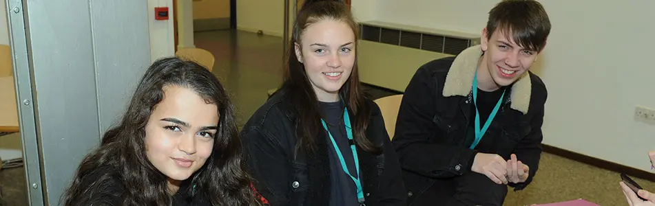 students smiling at the camera